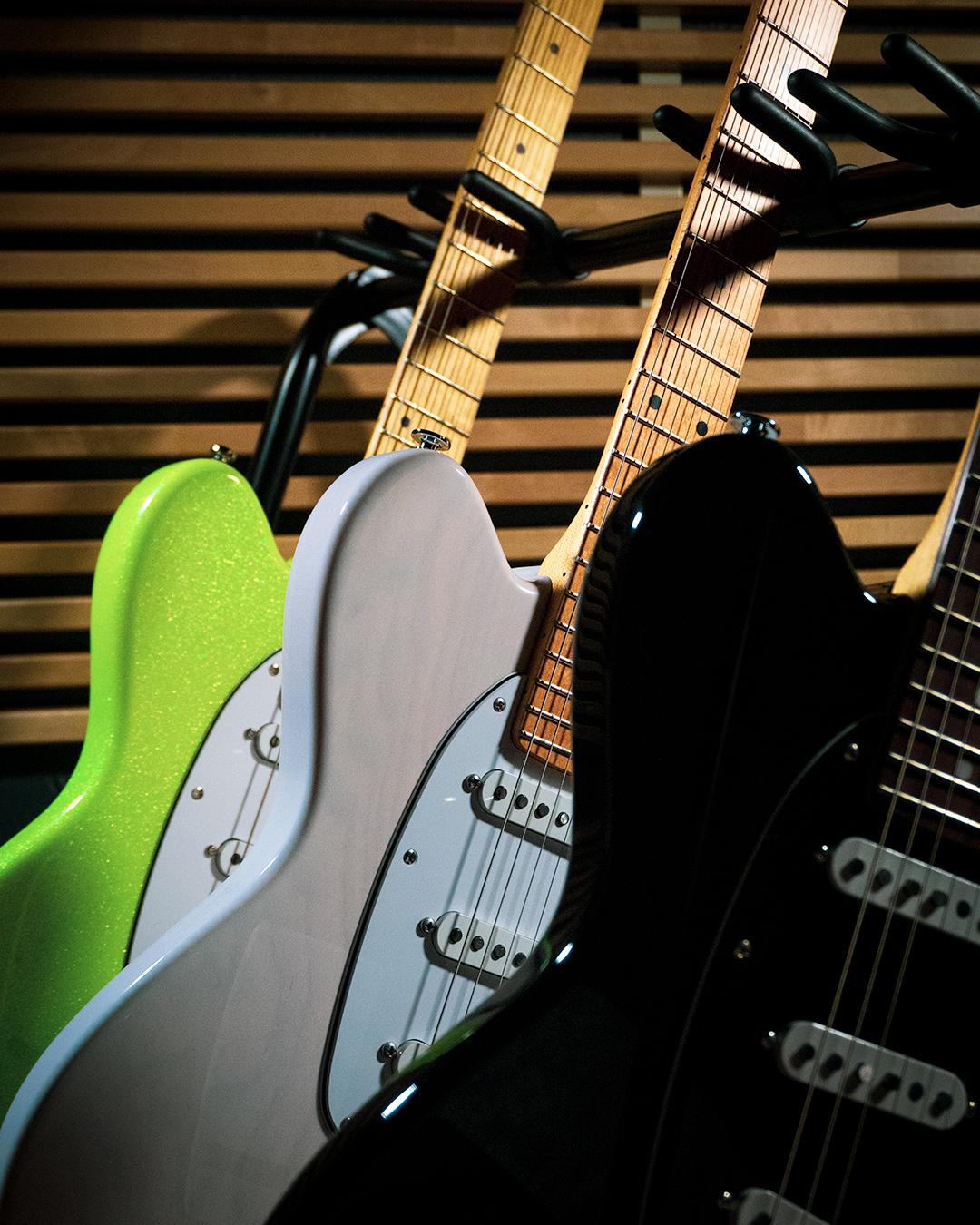 3 Talman guitars on a guitar stand
