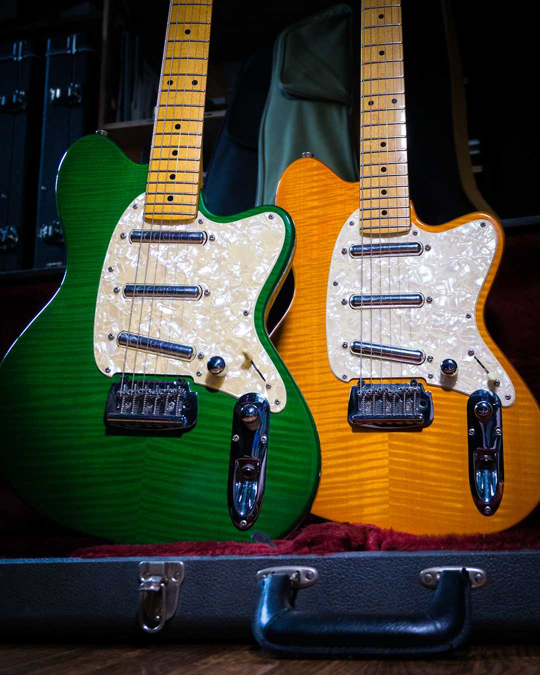 Two Talman TC830FM guitars. One of each color available, (TG) Transparent Green and  (BT) Butterscotch transparent