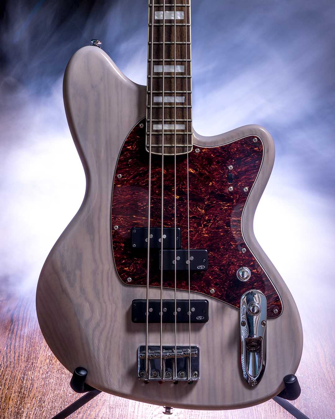 Talman Bass TMB600-AWD lit from behind, surrounded by smoke