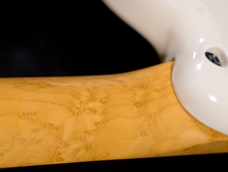 Closeup detail of gravure birdseye maple finish